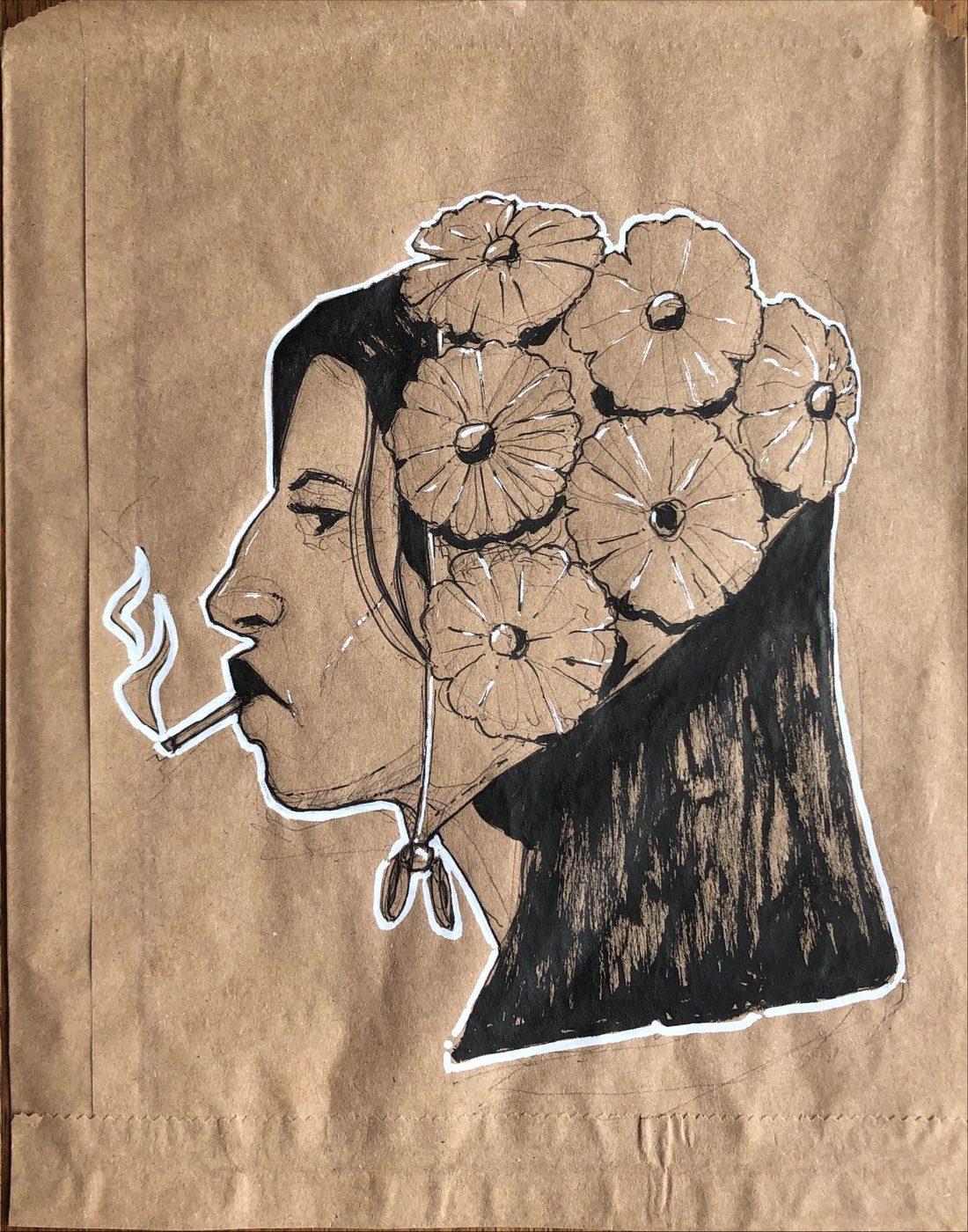 Ink profile with flowers in her hair and a cigarette, drawn on a brown paper bag