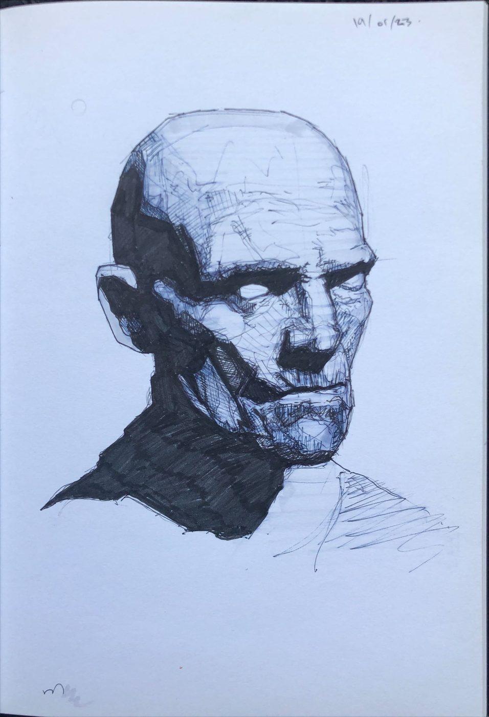 Sketchbook ink study of a bald head turned away, deep shadow